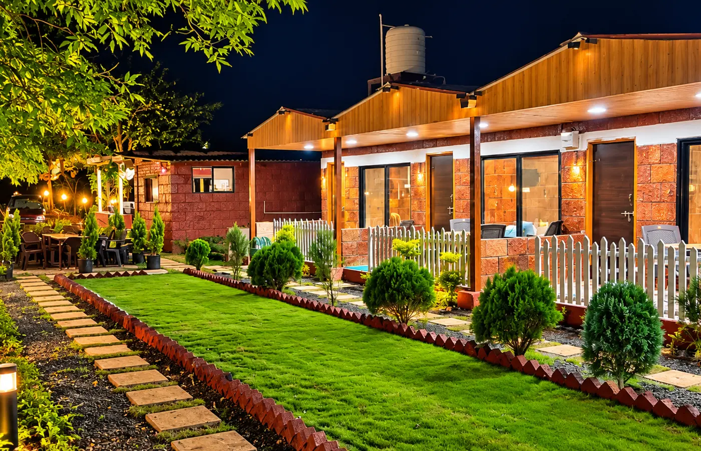 Jungle Mist Resort cottages and garden at night
